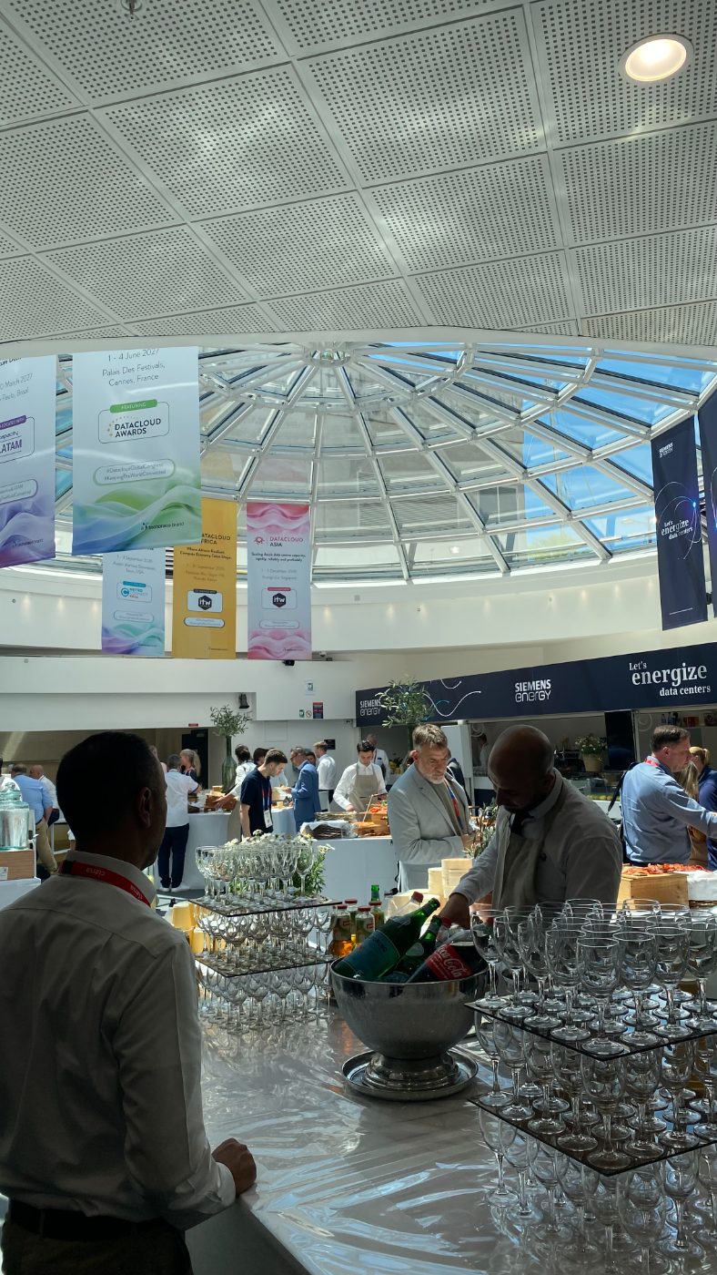 Lunch under the dome with Siemens Energy; the port with its cranes and its yachts. Two economies, one bay.