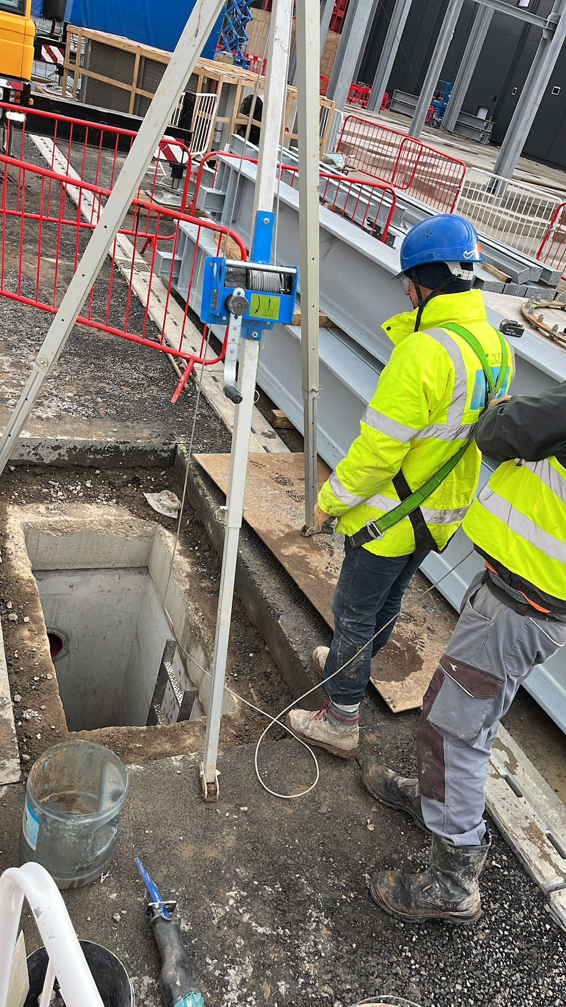 A crew working a confined-space lift on a data centre site