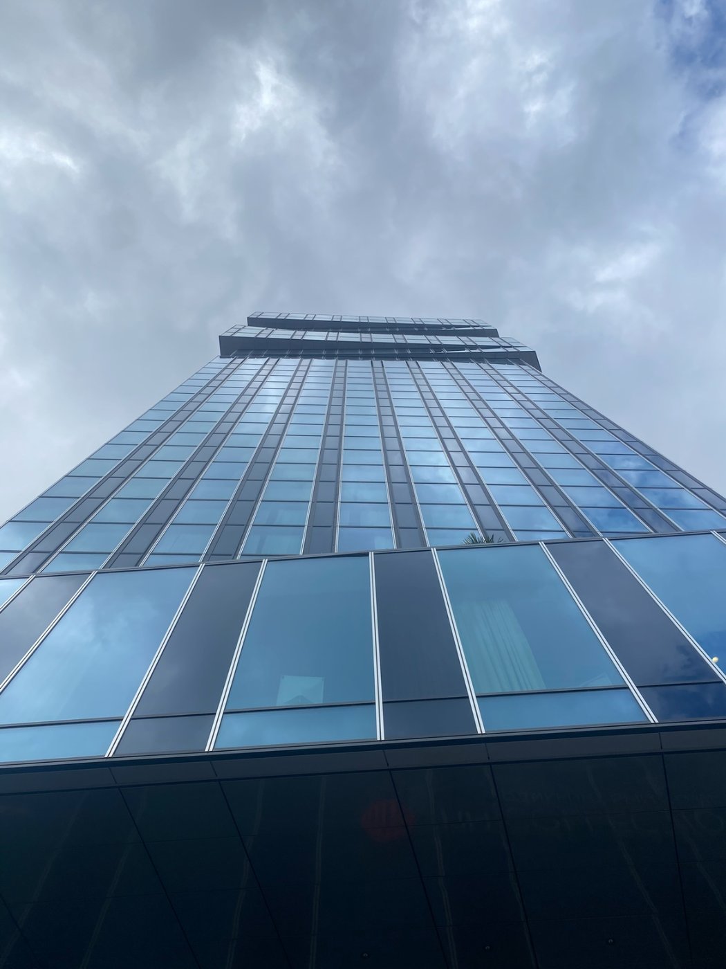 Frankfurt from the pavement. The banks are the visible part. The data centres are forty minutes east and have no windows.