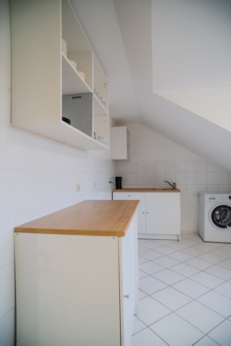 The kitchen. Big enough for the crew to cook at the same time, washing machine in the room, not in a shared basement.